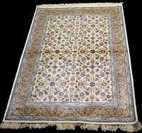 Lot 811 - A woven Kashmir rug, the ivory ground...