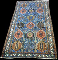 Lot 817 - A Bakhtiari carpet, decorated with panels of...