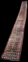 Lot 825 - An extensive Sarough runner, with flowerhead...