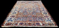 Lot 827 - A Persian Bakhtiari carpet, decorated with...