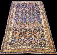 Lot 834 - A Bakhtiari carpet, with diamond-shaped panels...