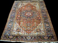 Lot 851 - A Heriz carpet, the central rosette on claret...