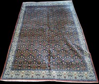 Lot 857 - A Senneh carpet, the dark blue ground with...