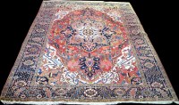 Lot 864 - A Heriz carpet, with bold floral geometric...