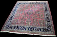 Lot 867 - A Sarough carpet, the puce field decorated...