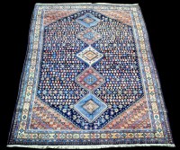 Lot 873 - A Yalameh carpet, the five diamond-shaped...