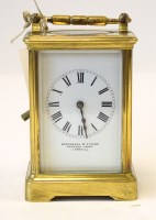 Lot 890 - A late 19th Century brass carriage clock, with...