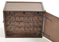 Lot 908 - An oak spice cabinet, the panel door enclosing...