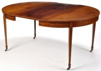 Lot 934 - A Sheraton revival inlaid mahogany extending...