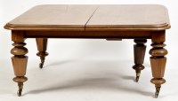 Lot 944 - A Victorian oak extending dining table, the...