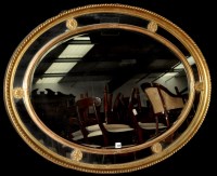 Lot 949 - A 19th Century giltwood oval wall mirror, the...