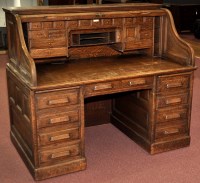 Lot 955 - Oak roll top desk, the tambour fall opening to...