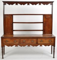 Lot 958 - An 18th Century oak dresser, the delft rack...