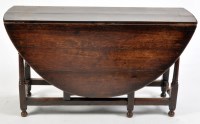 Lot 960 - An 18th Century oak drop leaf dining table,...