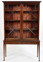 Lot 996 - A Georgian mahogany bookcase, the later...