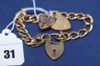 Lot 31 - A 9ct. yellow gold curb link bracelet with...