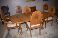 Lot 681 - An Indonesian hardwood dining table with...