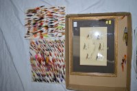 Lot 178 - A large collection of salmon flies mounted on...
