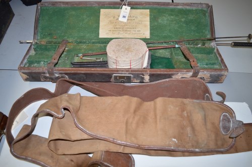 Lot 261 - A leather on wood roof rifle case with green...