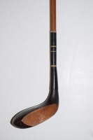 Lot 403 - A long nosed golf club with hickory shaft and...