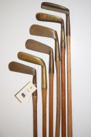 Lot 405 - Six hickory shafted brass headed putters,...