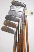 Lot 407 - Six hickory shafted iron headed putters,...