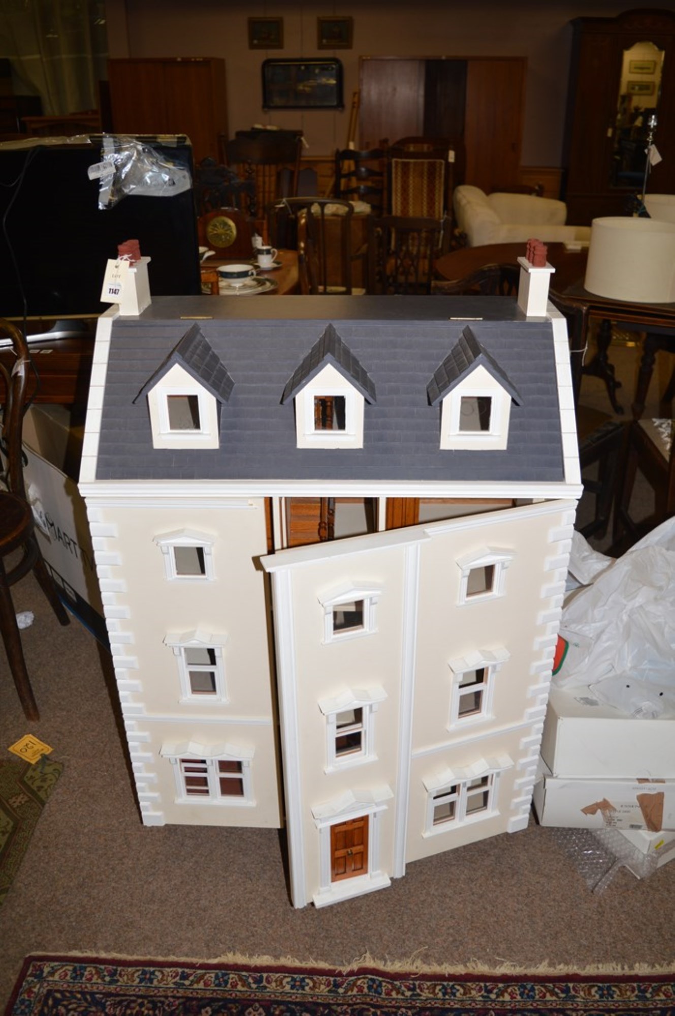 Lot 1147 A style 'Town House' dolls house,