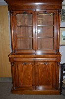 Lot 1271 - A Victorian mahogany bookcase, carved...