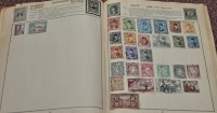Lot 256 - A Victory stamp album containing world stamps;...