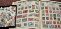 Lot 260 - A British Empire stamp album, including Hong...