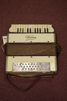 Lot 1504 - A mid 20th Century Vulcan accordion, in cream...