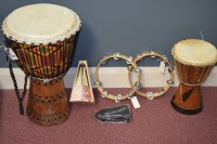 Lot 1540 - Two African-style drums, two tambourines, a...