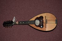 Lot 1548 - A eight string mandolin by F. Cassaro & G....