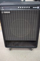 Lot 1577 - A Yamaha base amp, hundred 115B, on castors,...