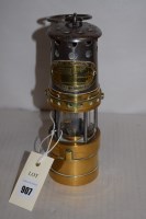 Lot 907 - A ''Midget'' brass and metal miners lamp, by E....