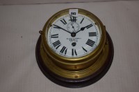 Lot 941 - A brass bulkhead clock, by Kevin Bottomley &...