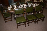 Lot 1138 - A 20th Century oak dining room suite, by...