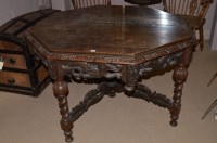 Lot 1231 - An early 20th Century heavily carved oak...