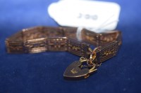 Lot 390 - A Victorian 9ct. rose gold gate link bracelet...