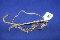 Lot 397 - A 14ct. yellow gold chain link bracelet,...