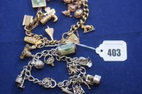 Lot 403 - A 9ct. yellow gold link bracelet with 9ct....