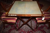 Lot 858 - A 19th Century inlaid mahogany folding games...