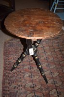 Lot 870 - A circular stained pine occasional table,...