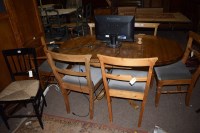 Lot 874 - A modern pine drop leaf dining table, raised...