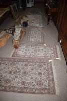 Lot 890 - Three Persian style rugs in cream and brown,...