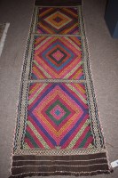 Lot 892 - A Suzni kilim runner in three panels with...