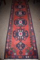 Lot 895 - A hand-knotted Persian style runner, four...