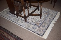 Lot 899 - A 20th Century Tabriz rug, 188 x 123cms wide.