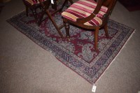 Lot 901 - A 20th Century Kerman Lavar rug on burgundy...