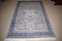 Lot 912 - A 20th Century hand knotted Tabriz rug, floral...